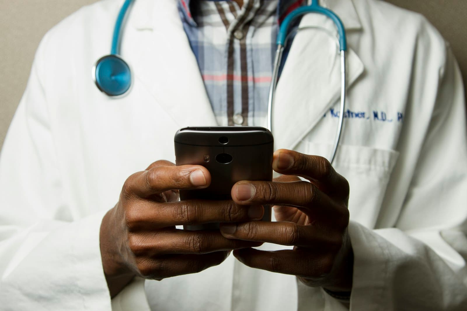 Doctor checking a patient's thyroid area